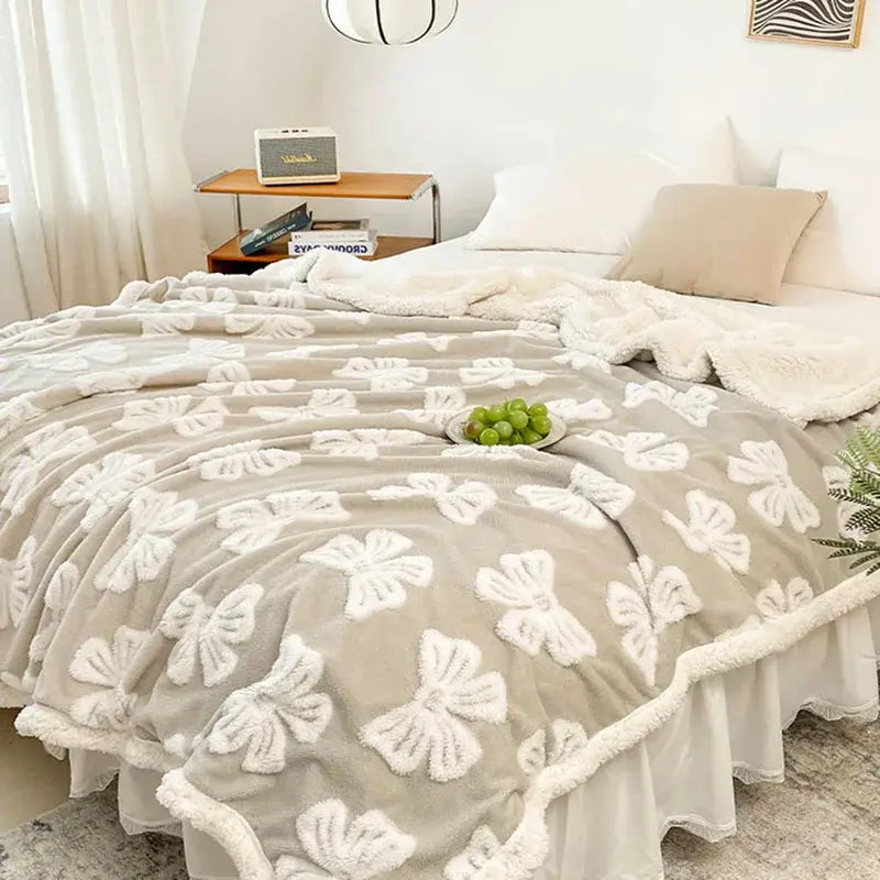 Taupe and white butterfly jacquard wool blanket fleece throw with raised bow patterns and matching ruffled edge decorbites butterfly jacquard