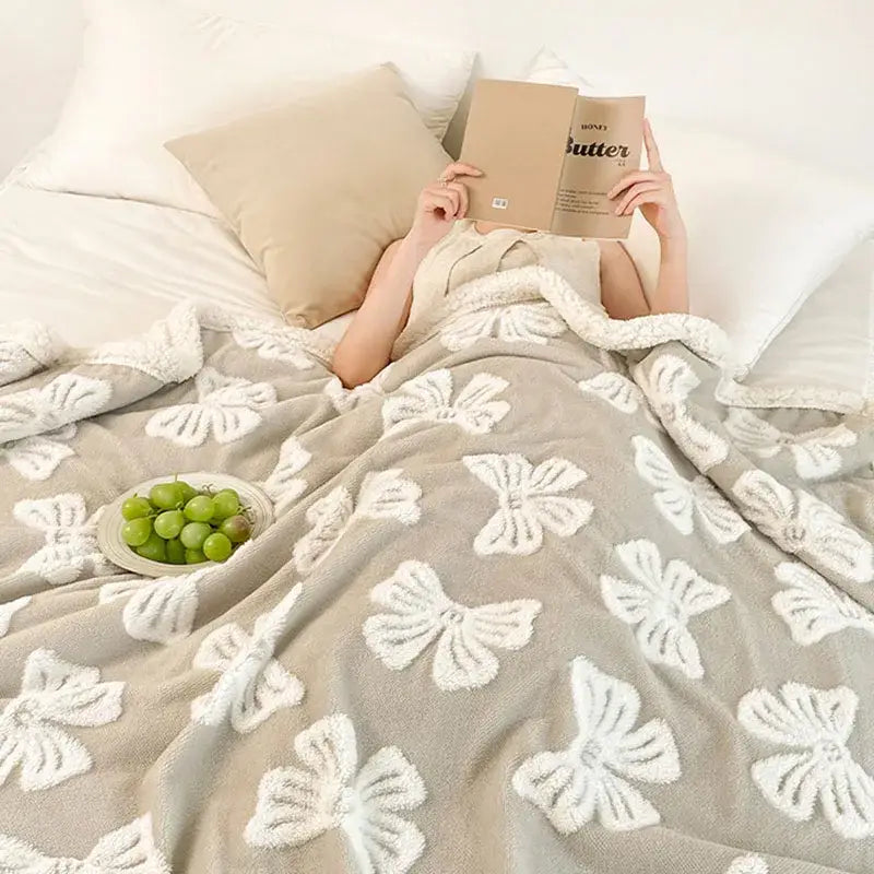 Soft gray wool blanket with plush white butterfly jacquard embroidery taupe and white decorbites fleece throw