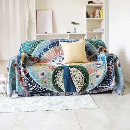 Vibrant teal and blue peacock knit sofa blanket cover with fringe edges perfect for decorbites knit sofa decor