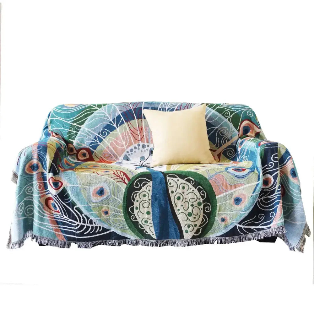 Vibrant peacock feather-patterned teal and blue knit sofa blanket cover with fringe edges for living room decorbites knit sofa