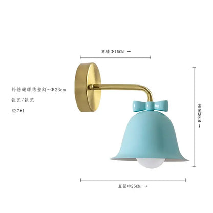 A light blue glass bowknot bell wall lamp with gold metal arm by decorbites for bedroom decor