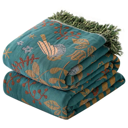 Teal birds jacquard cotton sofa cover with embroidered bird and foliage patterns in gold brown and gray with green fringe