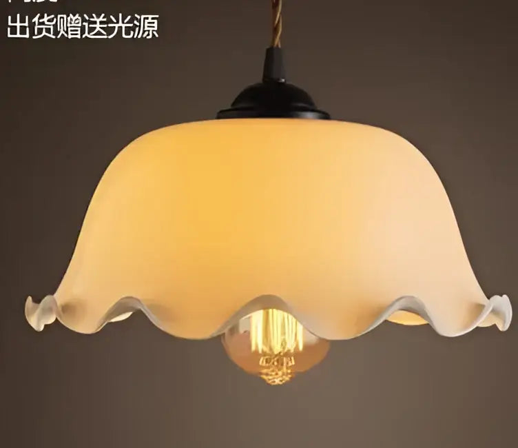 Cream-colored translucent glass pendant light with scalloped edge and exposed edison bulb for decorbites blue glass pendant lights