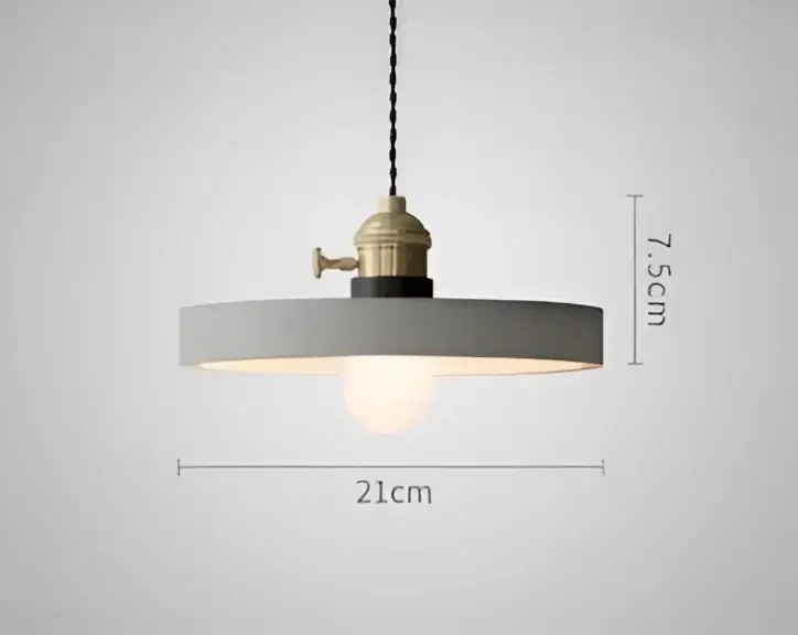 Minimalist gray pendant light with brass industrial fixture and exposed bulb complementing decorbites blue glass pendant lights