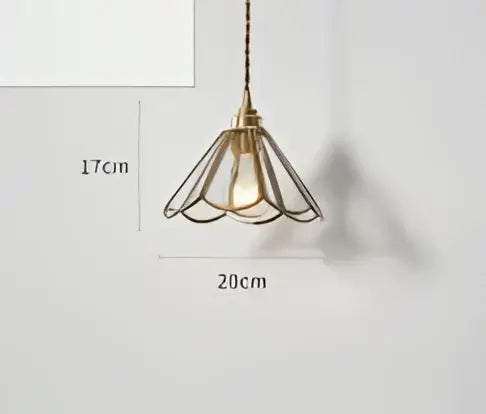 Teal blue glass pendant light with brass hardware and petal-shaped metal frame suspended by dark chain for dining room decorbites blue glass pendant lights