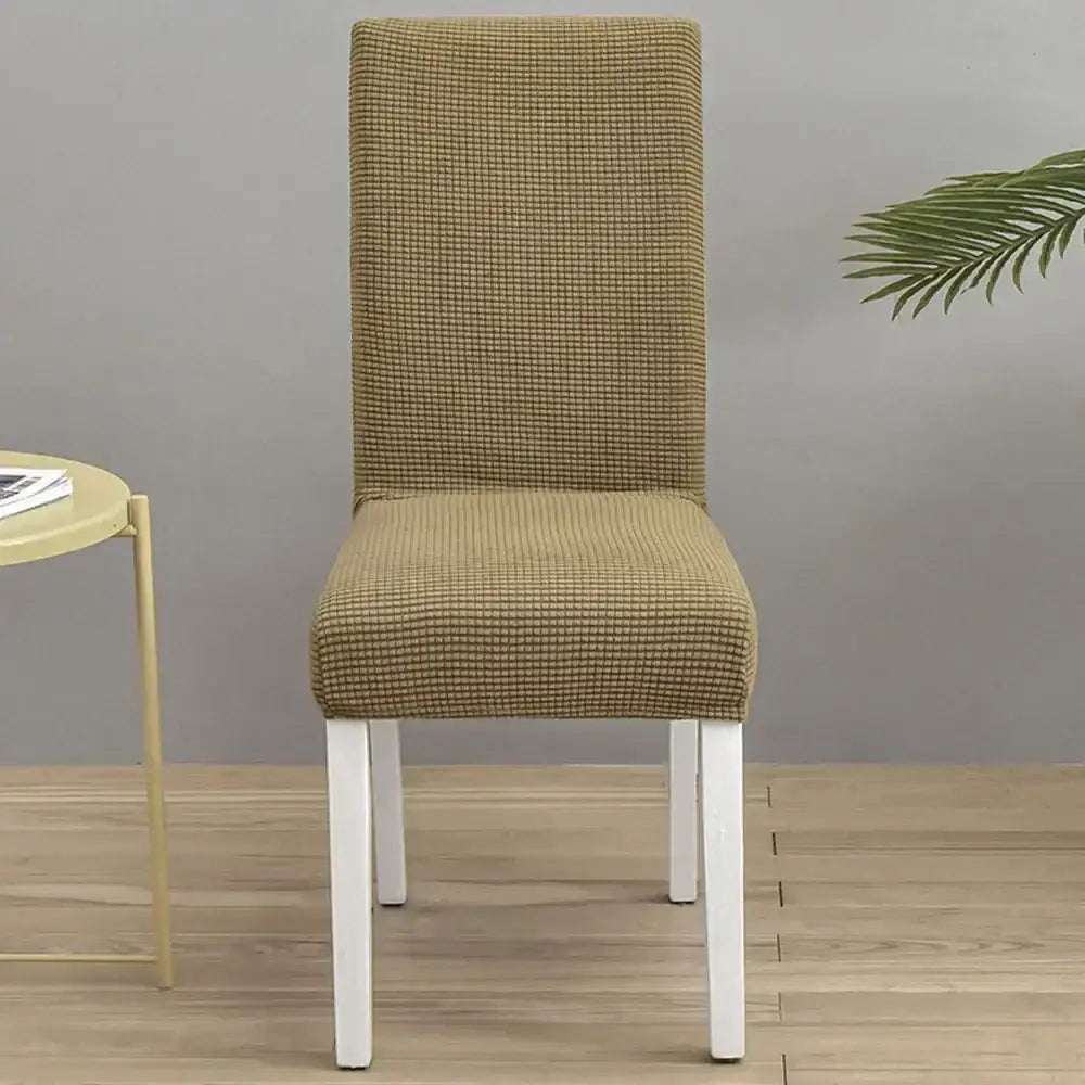 Beige checkered stretch chair cover showcasing decorbites blue quilted chair protector for dining room use