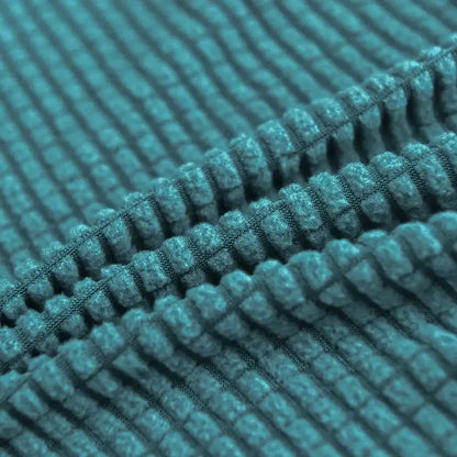 Teal blue quilted chair cover made of soft plush corduroy fabric with stretch elastic for dining room protection