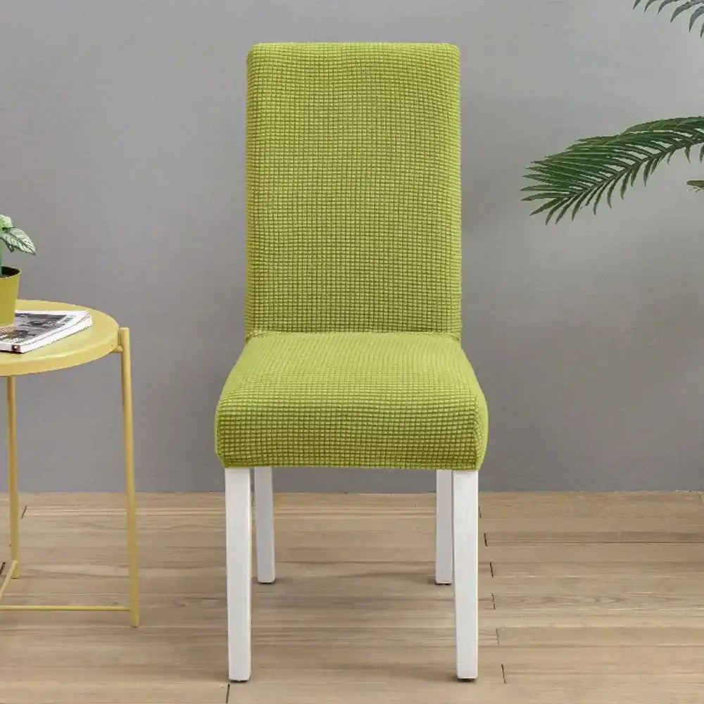 Teal blue quilted chair cover stretch elastic dining room protector on lime green textured white wooden chair