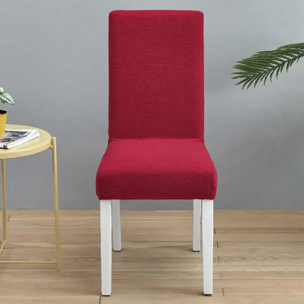 Red textured stretch chair cover showcasing decorbites blue quilted chair protection for dining room use