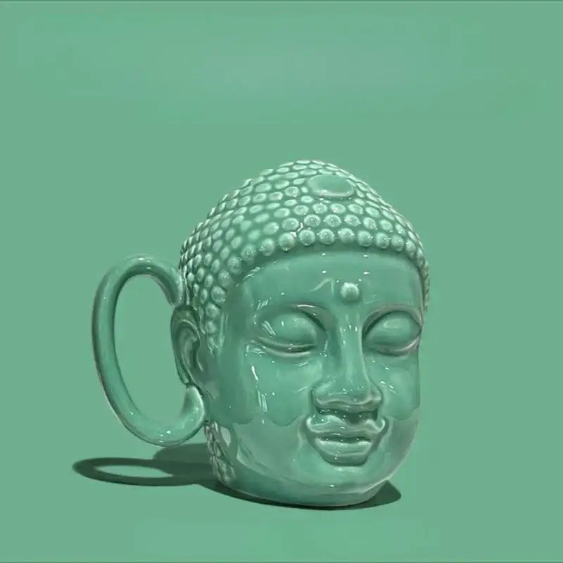 Teal buddha sculpture ceramic coffee mug with glazed turquoise finish and detailed dot patterns for decorbites buddha sculpture decor