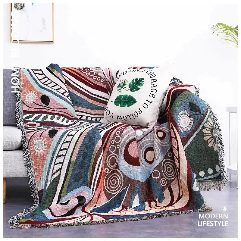 Teal butterfly carp pattern sofa blanket with colorful abstract designs and fringe edges for living room use