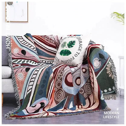 Teal butterfly carp pattern sofa blanket with colorful abstract designs and fringe edges for living room use