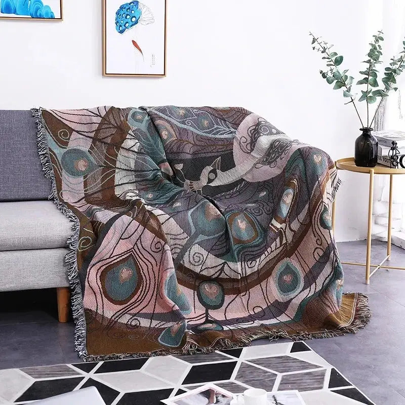 Teal butterfly carp pattern sofa blanket with peacock feather motifs in pink teal and brown featuring fringed edges