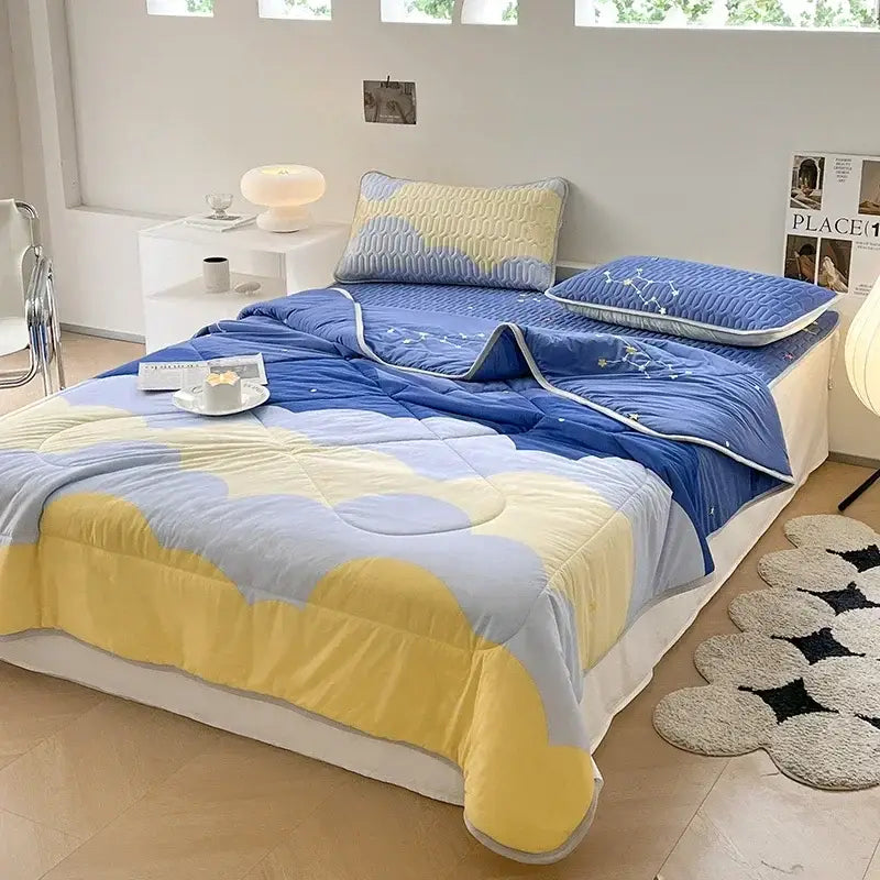 Teal and cream zigzag cool summer blanket set featuring a blue and yellow cloud-patterned plush quilt for decorbites cool summer use