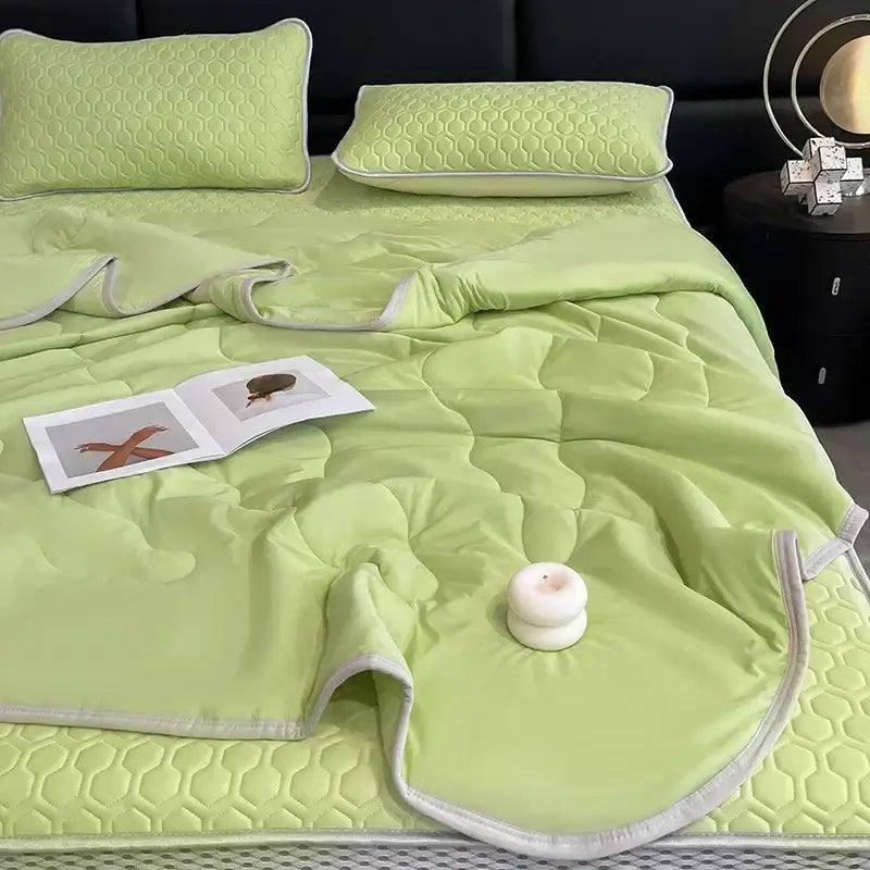 Light green quilted bedspread with honeycomb pattern and white piping from decorbites cool summer blanket set