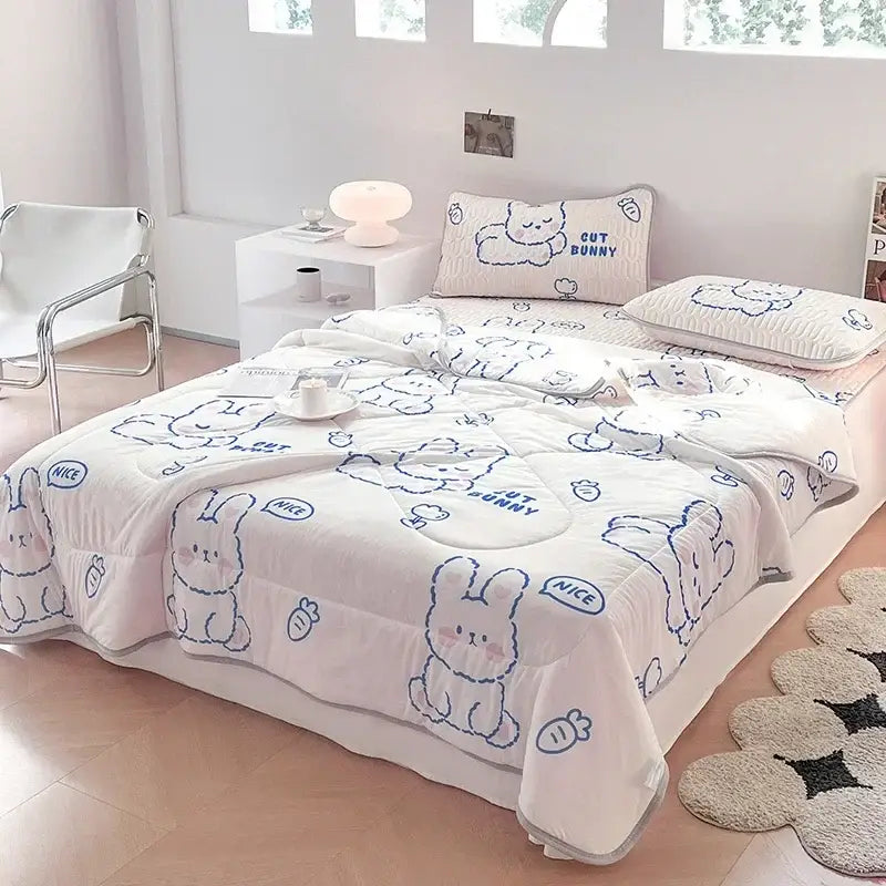 Pink bunny-themed blanket set with soft plush fabric and blue embroidered bunnies for decorbites cool summer use