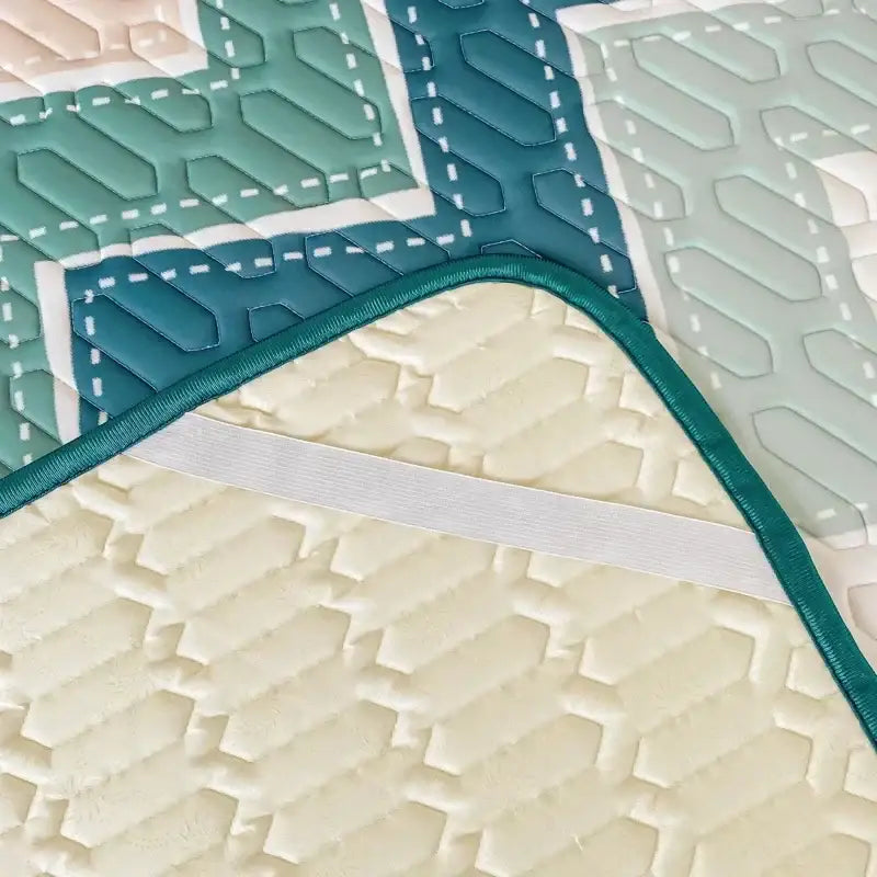 Teal and cream quilted cooling pad with hexagonal stitching and green ribbon trim in decorbites cool summer blanket set