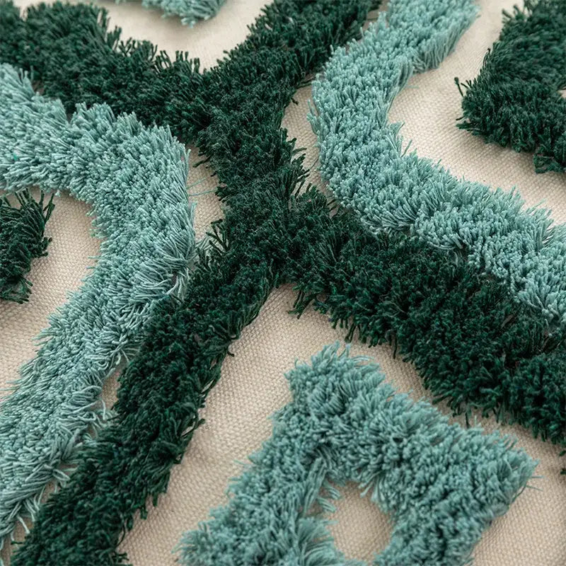 Textured teal and dark green fringe pattern on beige fabric boho tufted pillow covers decorbites boho living room decor