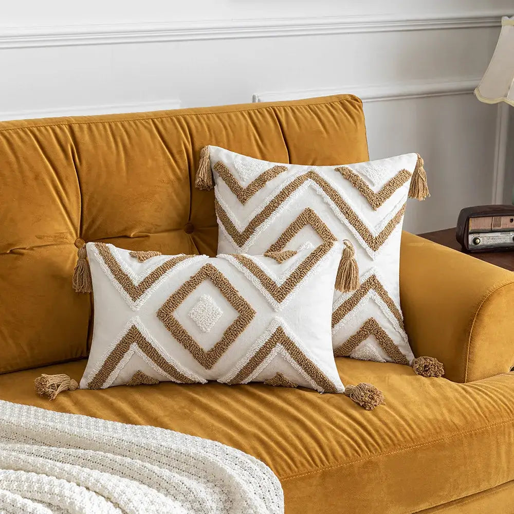 White and tan geometric decorbites boho tufted pillow covers with woven texture and tassels for living room decor