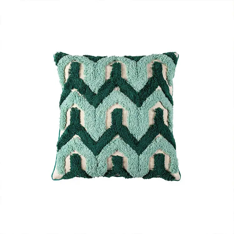 A plush teal and dark green cushion case with cream accents featuring decorbites geometric embroidery tassel pattern