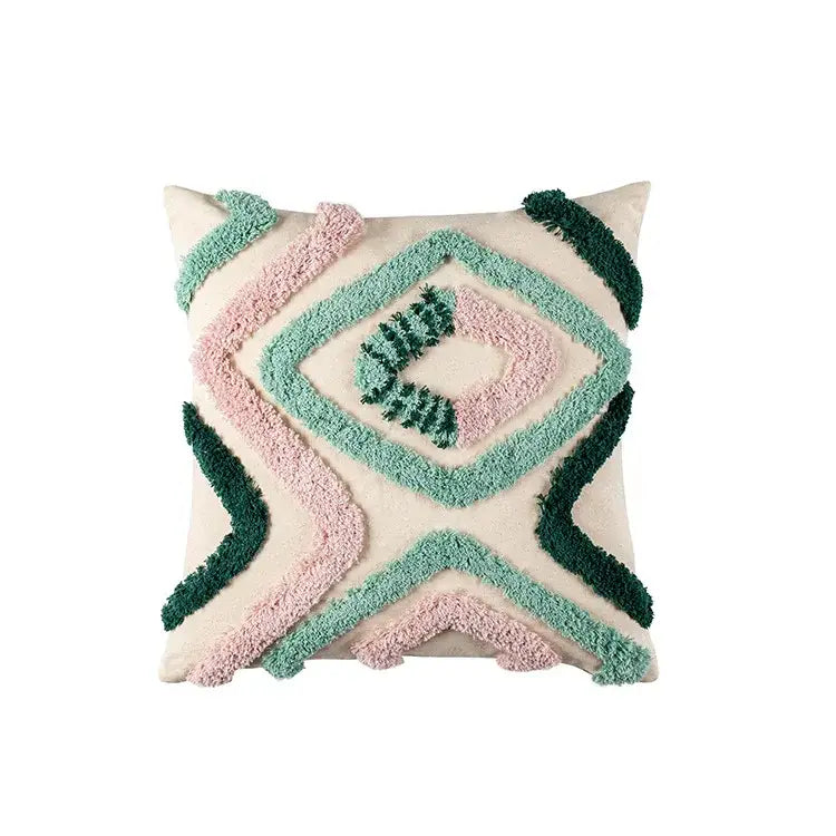 Cream-colored cushion case with soft pink and teal green decorbites geometric embroidery tassel pattern for living room decor