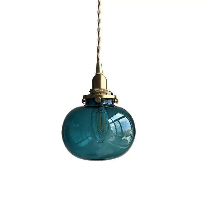 Teal glass ball pendant light with brass hardware and twisted cord by decorbites for bedroom lighting decor