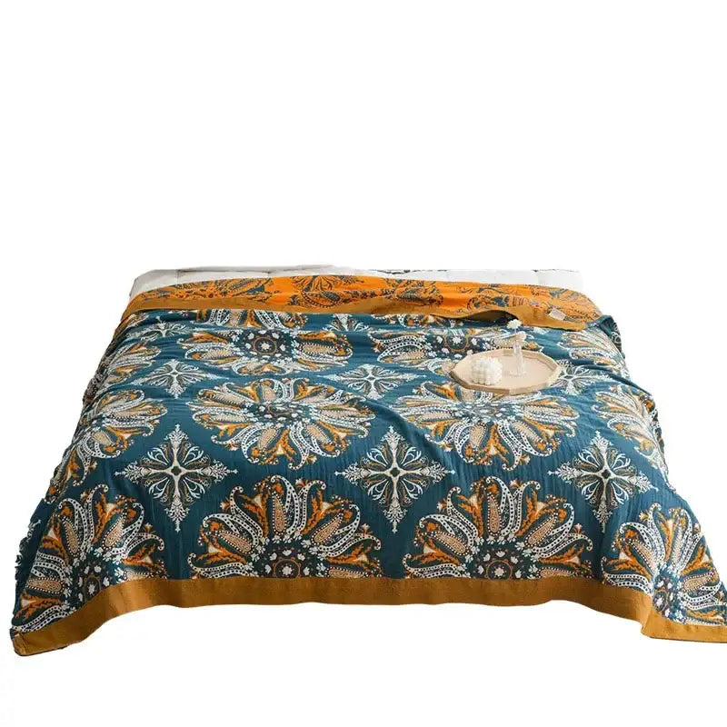 Teal and gold floral bohemia cotton blanket with intricate embroidery by decorbites bohemia cotton for bedroom decor