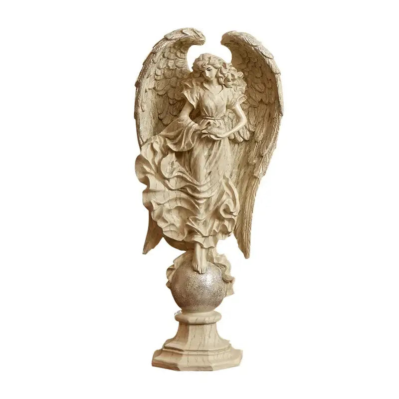 Beige prayer angel goddess statue with detailed wings and flowing gown on decorative globe base for greek mythology decor