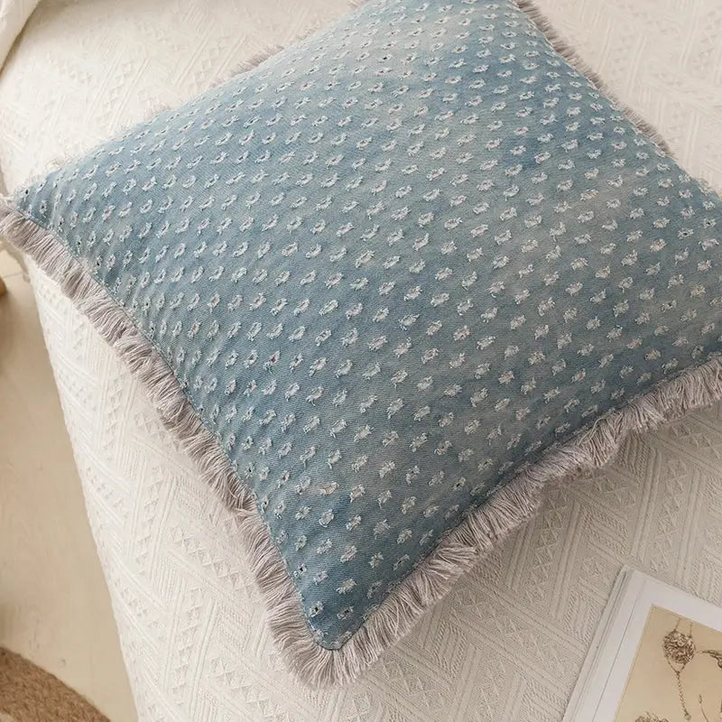 Teal and gray denim fringed cushion cover in soft blue fabric with white embroidery and frayed tassels for living room decorbites decor