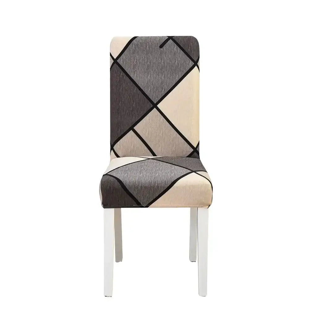 A modern dining chair featuring a decorbites geometric stretch chair cover in teal gray fabric with black lines