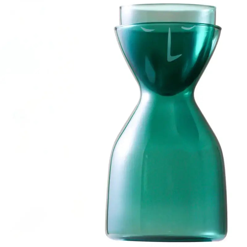 Teal hourglass glass tea infuser water bottle featuring a teal-green glass carafe with minimalist face design decorbites glass tea