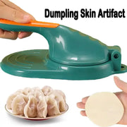 Teal plastic dumpling skin maker with an orange handle dough press tool for shaping dumpling dough circles