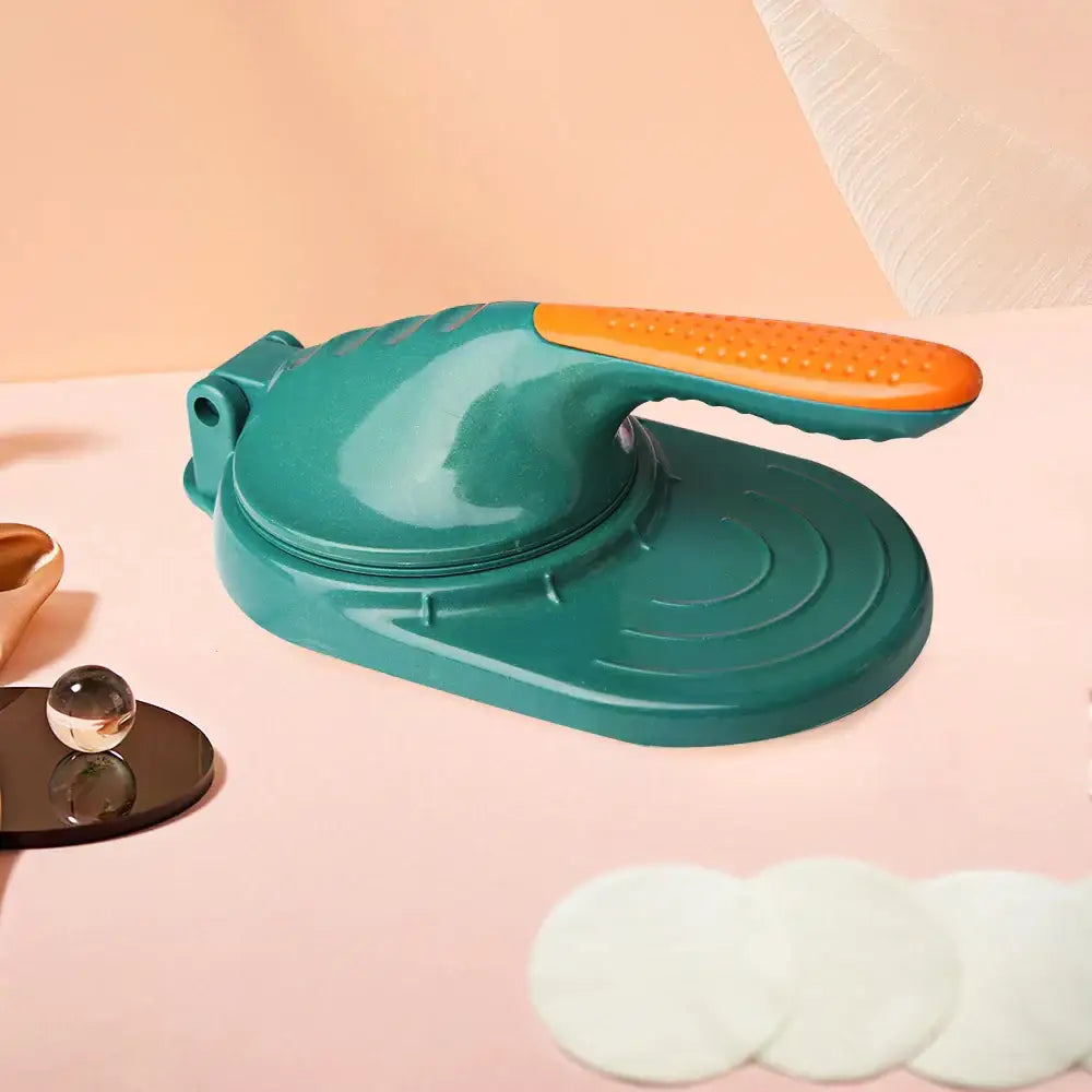 Teal and orange plastic dough press tool with textured grip handle designed as a dumpling skin maker for kitchen use