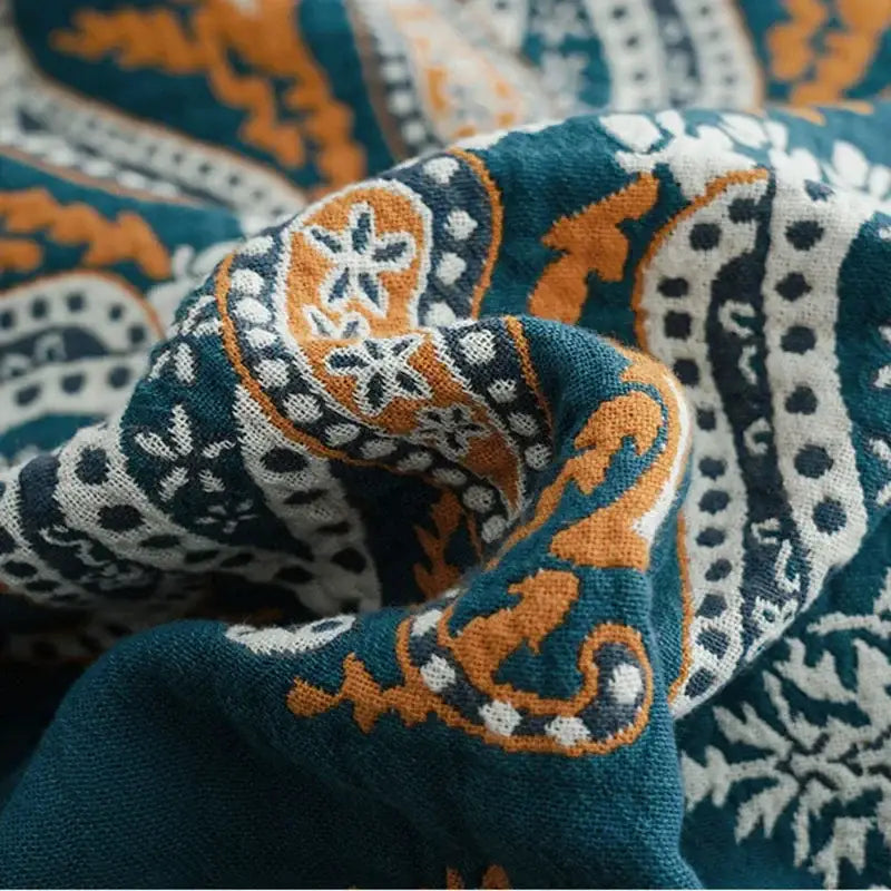 Teal and orange paisley-patterned geometric cotton gauze summer blanket with white accents for bedroom decorbites geometric cotton