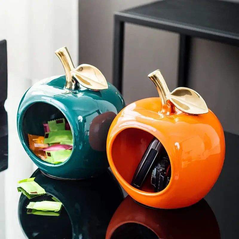 Teal and orange gold plated ceramic apple storage box with vibrant glazed fruit shapes and gold toned stems for living room storage
