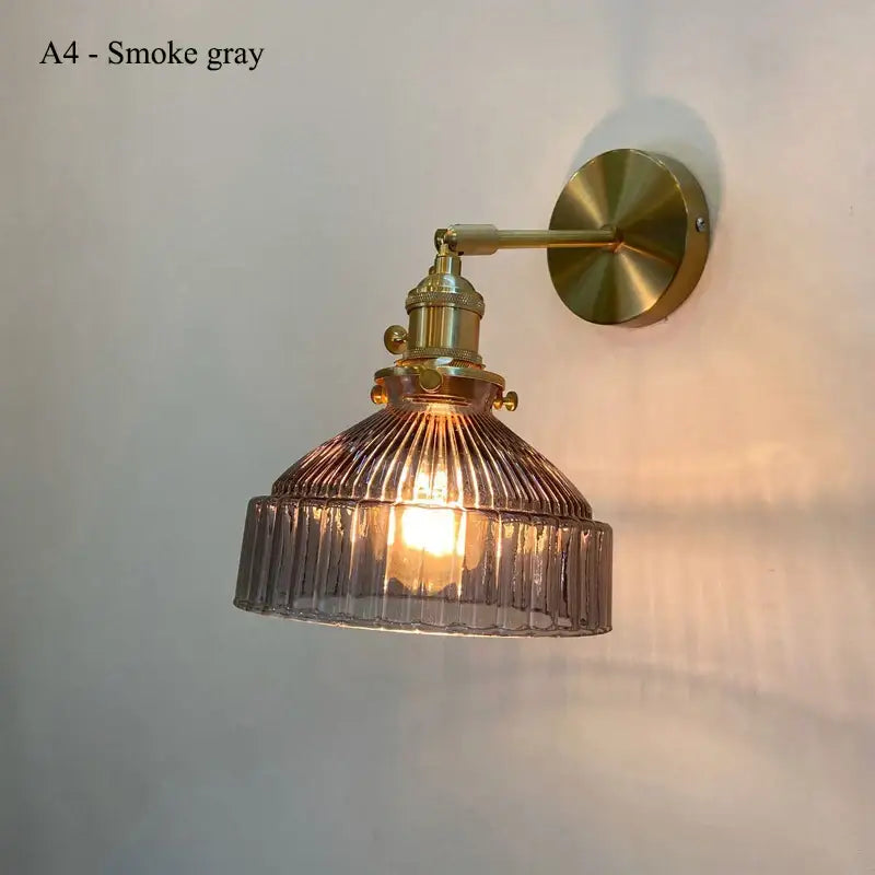 Teal ribbed glass shade led wall lamp with brass-finished metal arm for luxury living room decor and warm light diffusion