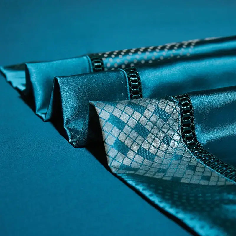 Teal satin fabric with subtle diamond-patterned weave and black embroidered trim from 1000tc egyptian cotton bedding set