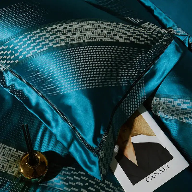 Teal satin pillow with geometric black and white mosaic edge in teal and silver 1000tc egyptian cotton bedding set