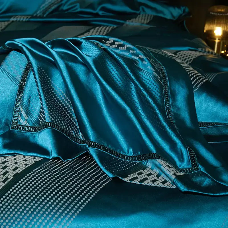 Teal satin bedspread with black and white geometric patterns in a 1000tc egyptian cotton bedding set