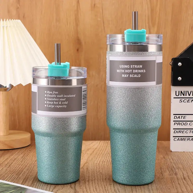 Two teal glitter-finish stainless steel insulated tumblers with silver lids and turquoise straw caps decorbites coffee cup thermos