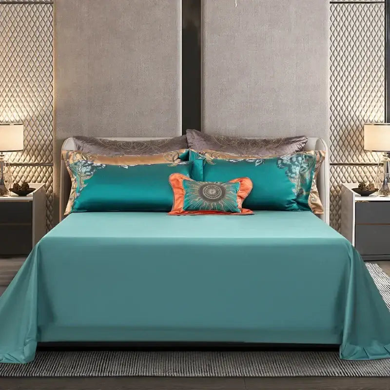 Teal satin bedding set with silver and gold embroidery featuring decorbites 1200tc jacquard and orange accent pillow