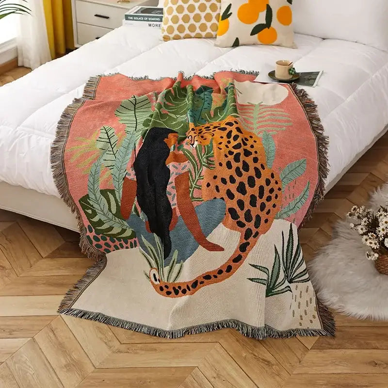 Vibrant decorbites knitted nordic outdoor sofa throw featuring a cheetah design on coral with fringed edges