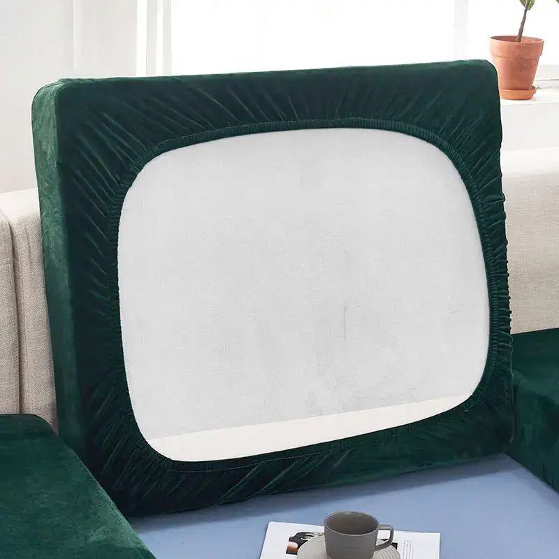 Teal velvet stretch sofa cushion cover featuring deep green plush velvet with elasticated edges for living room furniture protection