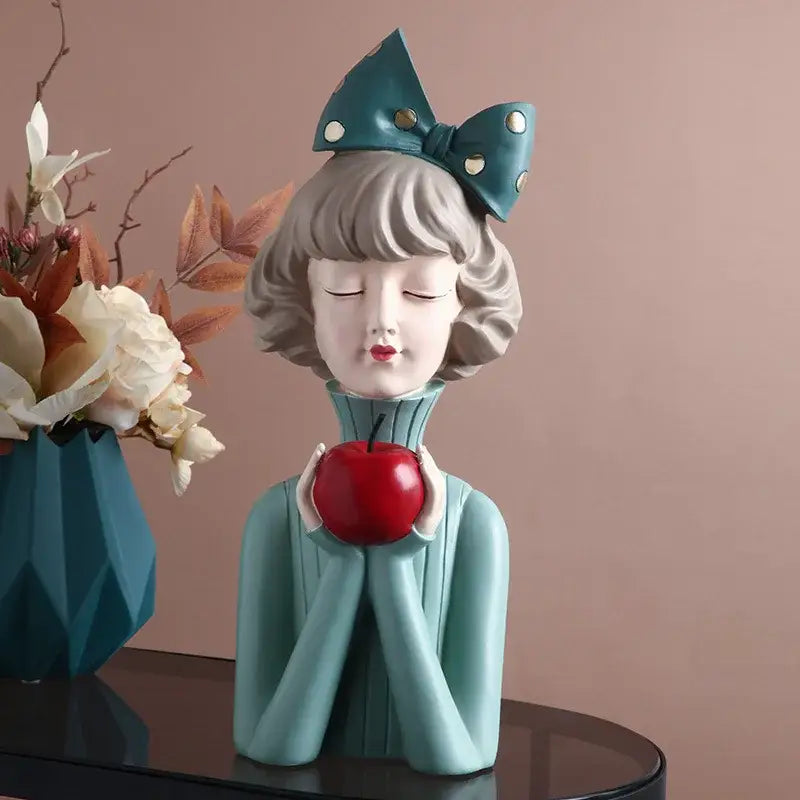 Teal bowknot girl resin figurine holding red apple with gold dotted bow on head for decorbites bedroom decor