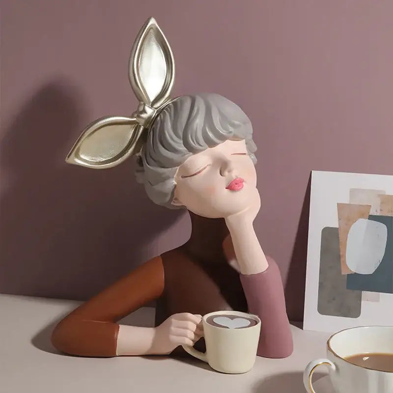 A teal and white bowknot girl resin figurine with gray hair and gold bow on gold tray for bedroom decorbites decor