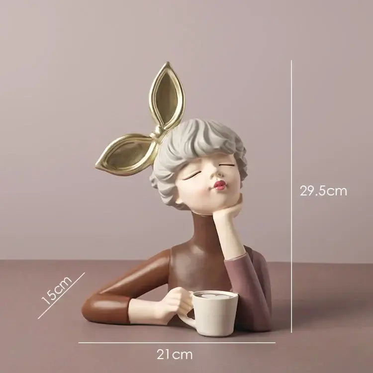 A teal and white bowknot girl resin figurine featuring a woman with gray hair holding a mug, ideal bedroom decor by decorbites