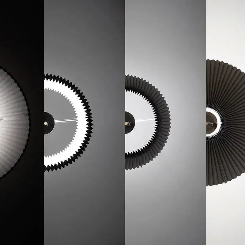 Black pleated circular ceiling light with glowing white inner ring from teal and white decorbites deformed fabric umbrella pendant