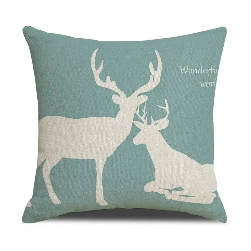 Teal linen throw pillow with white deer silhouette and wonderful world phrase featuring decorbites deer grid design