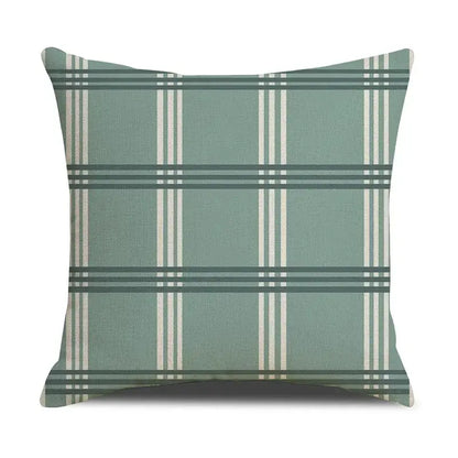 A square throw pillow with a sage green base and cream and dark teal plaid stripes in a decorbites deer grid line design