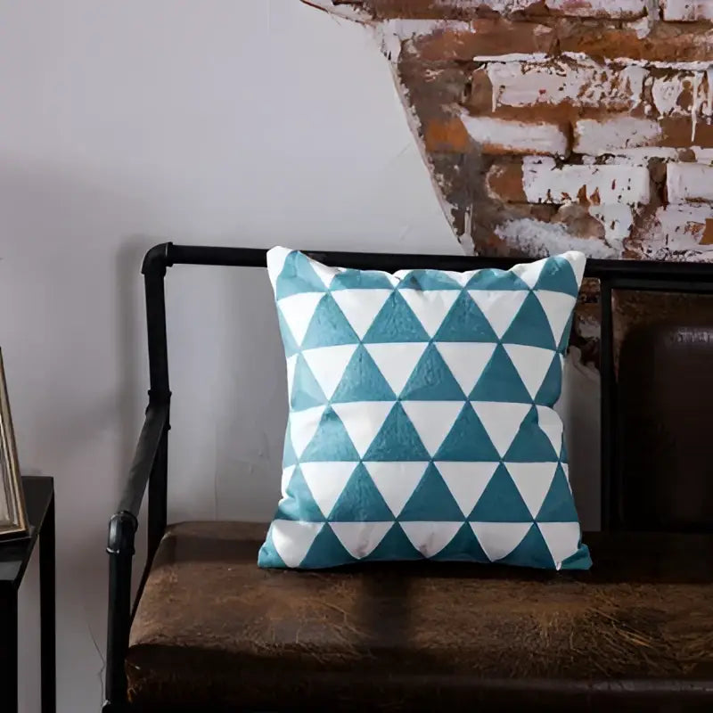 Teal and white geometric embroidered cushion cover featuring a blue geometric pattern for living room decorbites decor